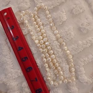 Baroque white/ivory pearl approximately 32" long necklace.